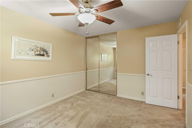 18836 Cedar Valley Way, Newhall, CA 91321 - unfurnished bedroom with a wainscoted wall, a closet, carpet floors, and ceiling fan