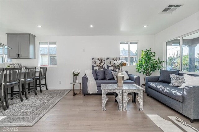 3818 Crawford St, Los Angeles, CA 90011 - living room featuring healthy amount of natural light, recessed lighting, and light wood-type flooring