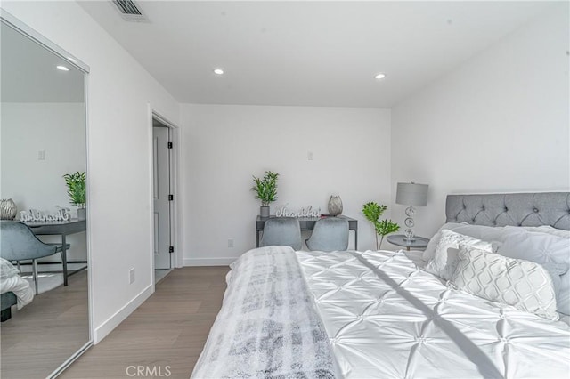 3818 Crawford St, Los Angeles, CA 90011 - bedroom featuring wood finished floors and recessed lighting