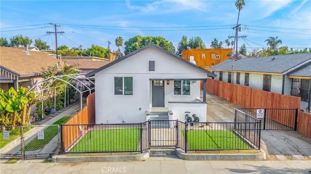 3818 Crawford St, Los Angeles, CA 90011 - bungalow-style home with a gate, a fenced front yard, and stucco siding