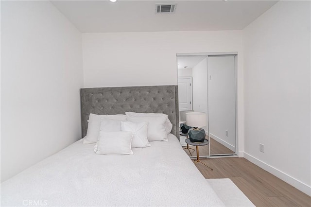 3818 Crawford St, Los Angeles, CA 90011 - bedroom with wood finished floors and baseboards