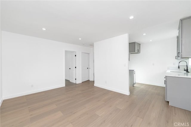 3818 Crawford St, Los Angeles, CA 90011 - unfurnished living room with light wood-style flooring and recessed lighting
