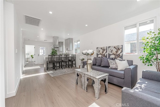 3818 Crawford St, Los Angeles, CA 90011 - living area with light wood finished floors and recessed lighting