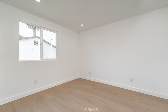3818 Crawford St, Los Angeles, CA 90011 - empty room featuring light wood-style flooring and recessed lighting