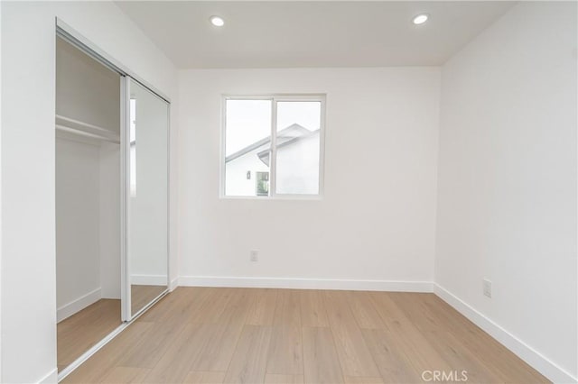 3818 Crawford St, Los Angeles, CA 90011 - unfurnished bedroom with light wood-style floors, recessed lighting, and a closet