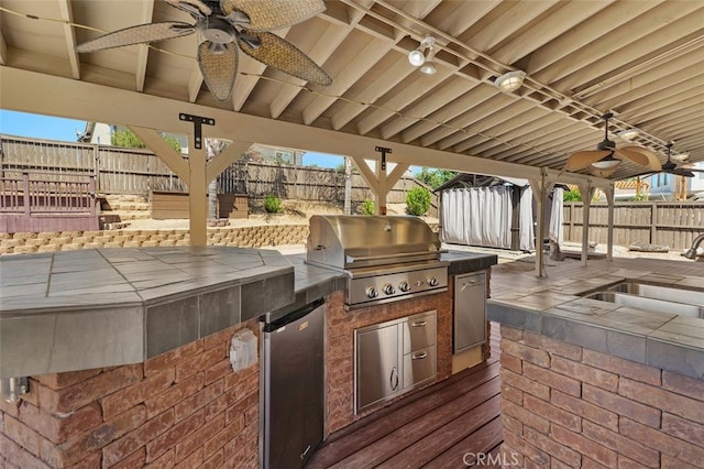 23050 Catt Rd, Wildomar, CA 92595 - fenced backyard featuring a ceiling fan, area for grilling, and a patio