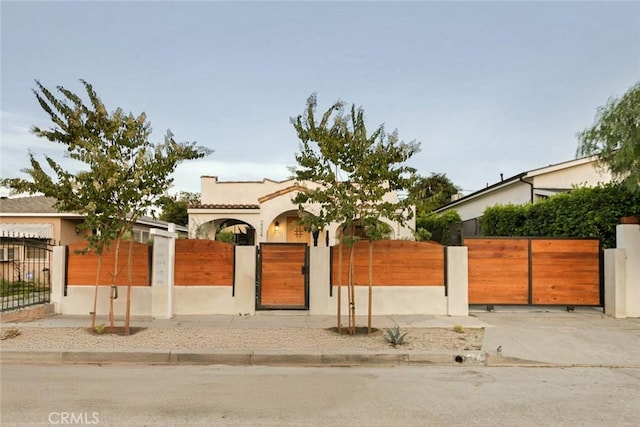2334 Glover Pl, Los Angeles, CA 90031 - view of front of house featuring a gate, a fenced front yard, and stucco siding