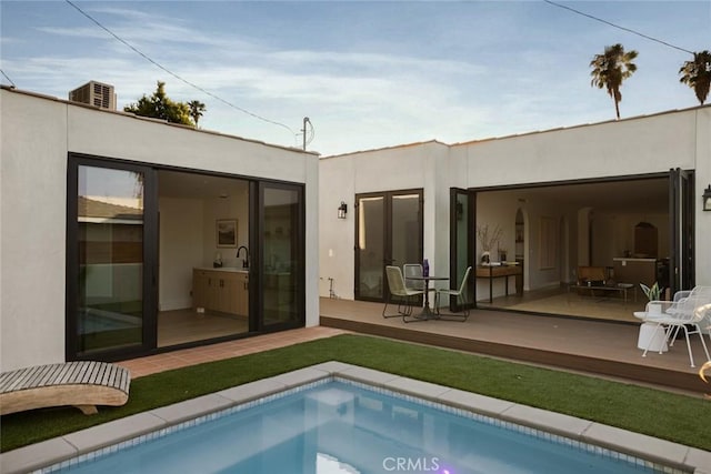 2334 Glover Pl, Los Angeles, CA 90031 - back of house featuring stucco siding and an outdoor pool
