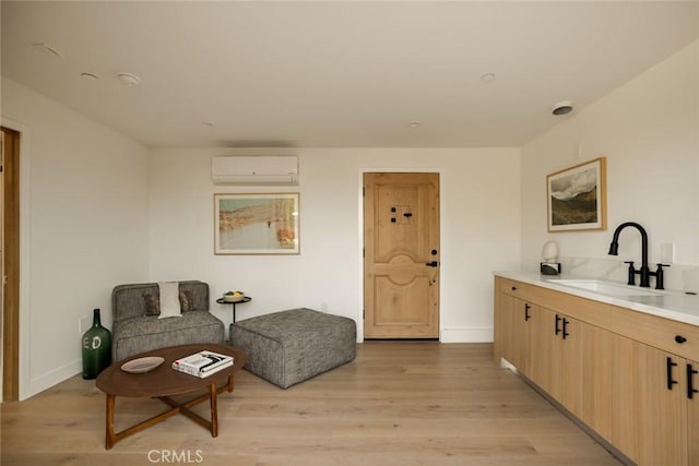 2334 Glover Pl, Los Angeles, CA 90031 - sitting room featuring a wall unit AC and light wood-style flooring