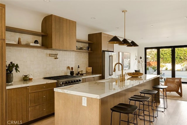 2334 Glover Pl, Los Angeles, CA 90031 - kitchen with open shelves, tasteful backsplash, light wood finished floors, brown cabinets, and a kitchen bar