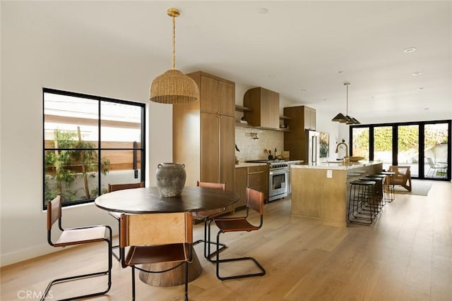 2334 Glover Pl, Los Angeles, CA 90031 - dining space featuring light wood finished floors and baseboards