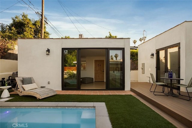 2334 Glover Pl, Los Angeles, CA 90031 - rear view of property with an outdoor structure, an outdoor pool, stucco siding, and a wooden deck