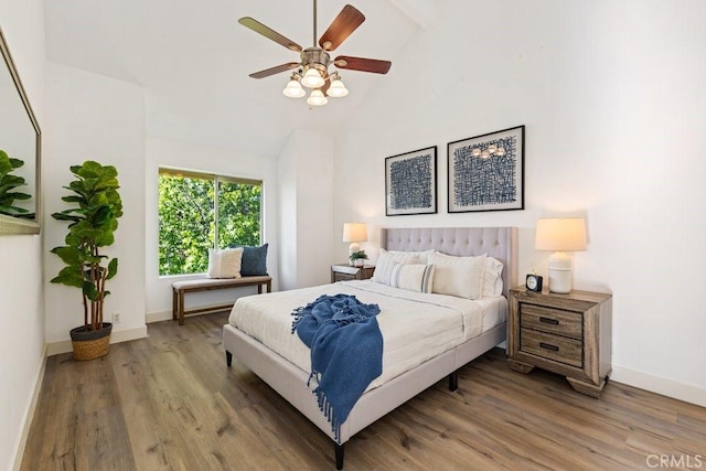 20371 Bluffside Cir Unit B401, Huntington Beach, CA 92646 - bedroom with wood finished floors, a ceiling fan, beam ceiling, and high vaulted ceiling