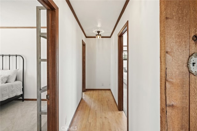 10821 Los Jordans Rd, Agua Dulce, CA 91390 - corridor featuring crown molding and light wood finished floors