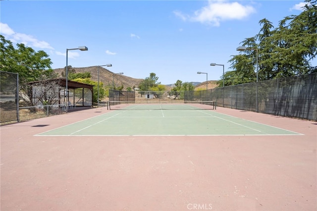 10821 Los Jordans Rd, Agua Dulce, CA 91390 - view of tennis court featuring community basketball court