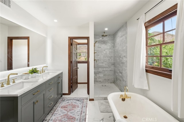 10821 Los Jordans Rd, Agua Dulce, CA 91390 - full bathroom featuring a soaking tub, double vanity, a tile shower, marble look tile flooring, and recessed lighting
