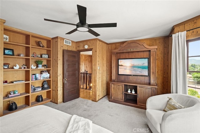 10821 Los Jordans Rd, Agua Dulce, CA 91390 - bedroom featuring carpet floors, multiple windows, wood walls, and a ceiling fan