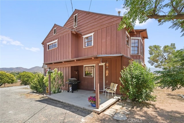 10821 Los Jordans Rd, Agua Dulce, CA 91390 - view of front facade featuring a patio area and board and batten siding