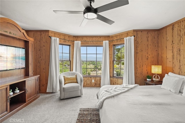 10821 Los Jordans Rd, Agua Dulce, CA 91390 - carpeted bedroom with multiple windows, wood walls, and ceiling fan