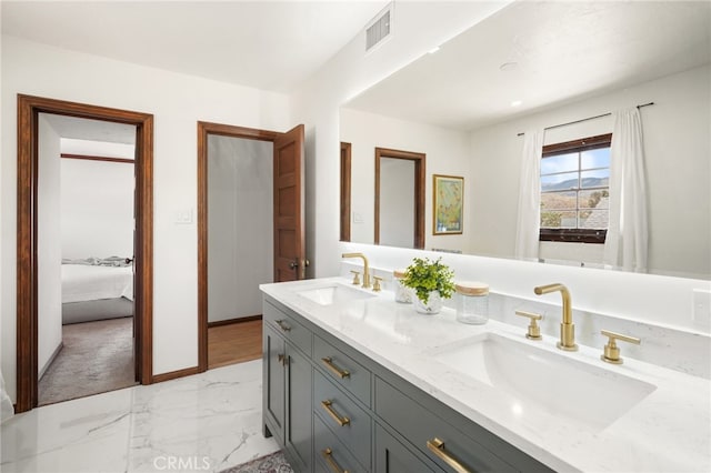 10821 Los Jordans Rd, Agua Dulce, CA 91390 - bathroom with double vanity, connected bathroom, and marble look tile flooring