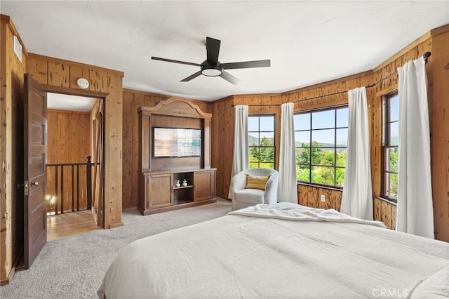 10821 Los Jordans Rd, Agua Dulce, CA 91390 - bedroom featuring wood walls, light colored carpet, and a ceiling fan