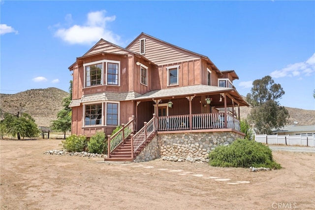10821 Los Jordans Rd, Agua Dulce, CA 91390 - view of front of house featuring covered porch, board and batten siding, and a mountain view