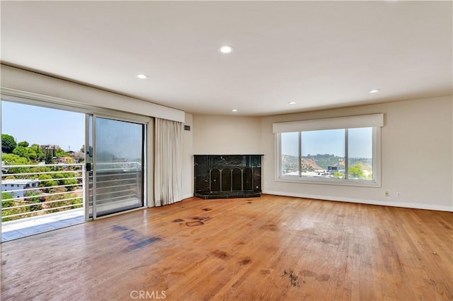 728 Quail Dr, Los Angeles, CA 90065 - unfurnished living room featuring wood finished floors, a fireplace, and recessed lighting