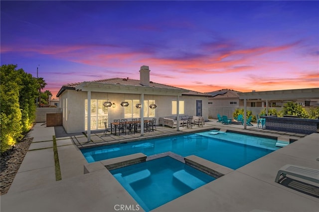 80848 Sunspring Ct, Indio, CA 92201 - view of swimming pool featuring a patio, a pool with connected hot tub, a fenced backyard, and outdoor dining area
