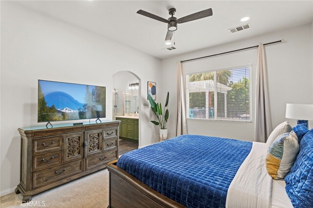 80848 Sunspring Ct, Indio, CA 92201 - bedroom with light colored carpet, ensuite bathroom, and a ceiling fan