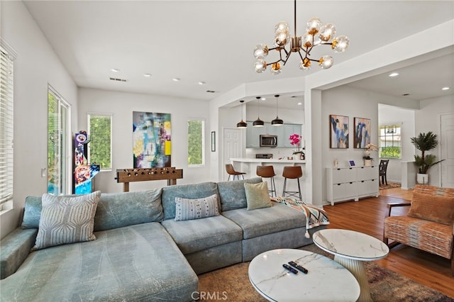 80848 Sunspring Ct, Indio, CA 92201 - living room featuring wood finished floors, healthy amount of natural light, recessed lighting, and a chandelier