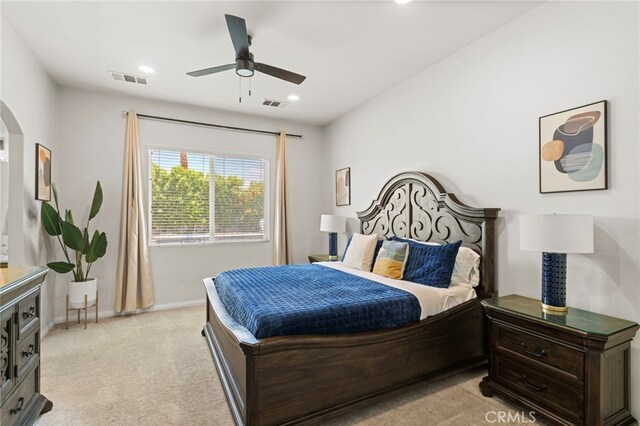 80848 Sunspring Ct, Indio, CA 92201 - bedroom featuring light carpet, arched walkways, recessed lighting, and ceiling fan