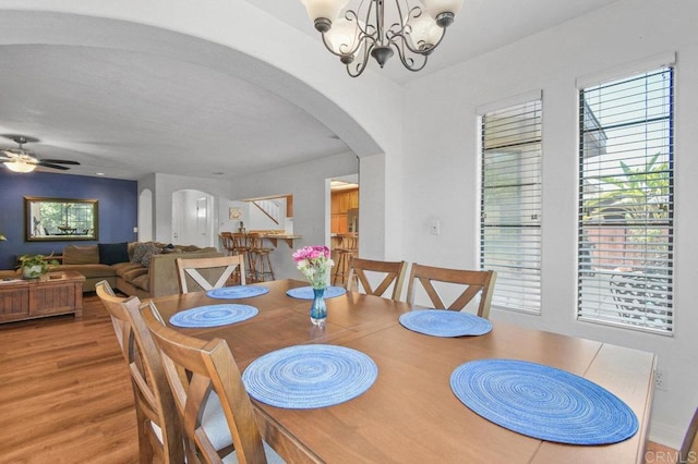 5855 Kappa St, La Mesa, CA 91942 - dining room with arched walkways, wood finished floors, a chandelier, and ceiling fan