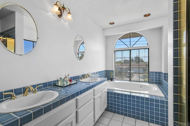 5855 Kappa St, La Mesa, CA 91942 - bathroom featuring tile patterned flooring, double vanity, and a bath