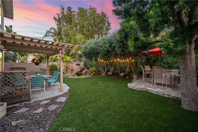 762 Twin Peaks Ave, Simi Valley, CA 93065 - yard at dusk with a patio area, a pergola, and a fenced backyard