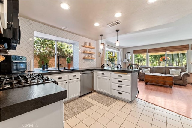 762 Twin Peaks Ave, Simi Valley, CA 93065 - kitchen featuring dishwasher, dark countertops, open floor plan, recessed lighting, and a peninsula