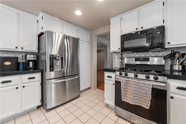 762 Twin Peaks Ave, Simi Valley, CA 93065 - kitchen featuring appliances with stainless steel finishes, arched walkways, white cabinets, backsplash, and recessed lighting