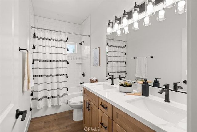6105 Maxwood Dr, Paradise, CA 95969 - full bath with double vanity, shower / bath combo with shower curtain, and wood finished floors