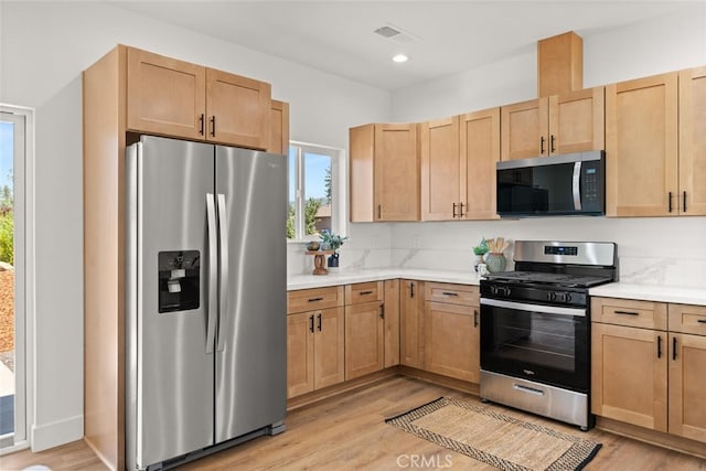 6105 Maxwood Dr, Paradise, CA 95969 - kitchen featuring appliances with stainless steel finishes, light countertops, light wood-type flooring, light brown cabinets, and recessed lighting