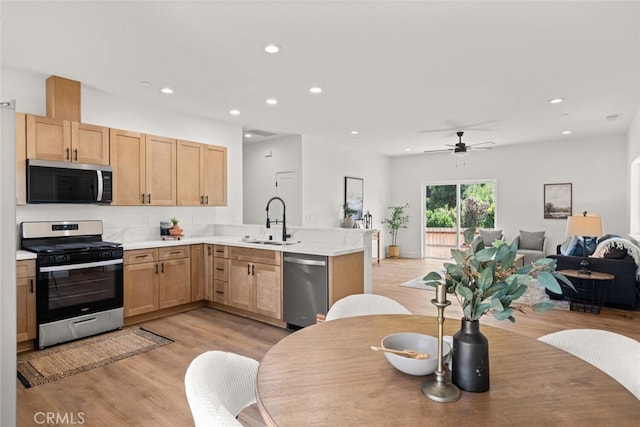 6105 Maxwood Dr, Paradise, CA 95969 - kitchen with stainless steel appliances, open floor plan, a peninsula, light brown cabinets, and recessed lighting
