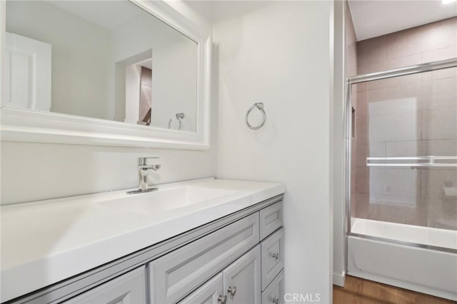 28512 Conejo View Dr, Agoura Hills, CA 91301 - full bathroom featuring vanity, bath / shower combo with glass door, and wood finished floors