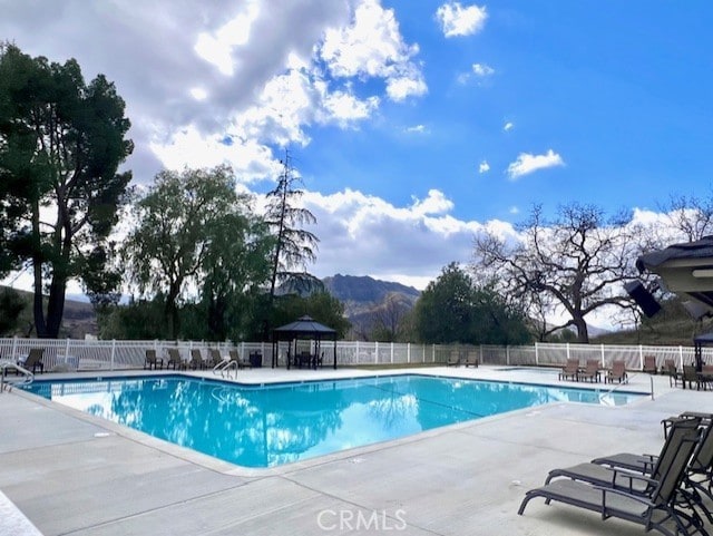 28512 Conejo View Dr, Agoura Hills, CA 91301 - community pool featuring a patio area, a mountain view, and a gazebo