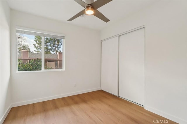 28512 Conejo View Dr, Agoura Hills, CA 91301 - unfurnished bedroom with light wood finished floors, a closet, and a ceiling fan