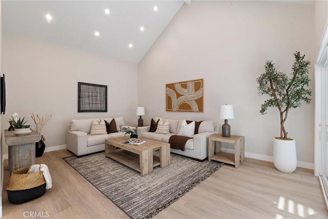 14 Willow Tree Ln, Irvine, CA 92612 - living room with high vaulted ceiling, light wood finished floors, and recessed lighting