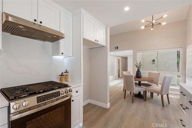 14 Willow Tree Ln, Irvine, CA 92612 - kitchen with stainless steel range with gas stovetop, under cabinet range hood, a chandelier, light wood-type flooring, and light countertops