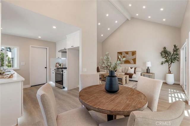 14 Willow Tree Ln, Irvine, CA 92612 - dining area featuring beam ceiling, light wood-style flooring, high vaulted ceiling, and recessed lighting