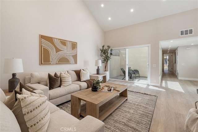 14 Willow Tree Ln, Irvine, CA 92612 - living room with high vaulted ceiling, light wood-style floors, and recessed lighting
