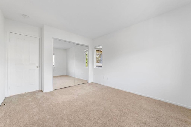 13756 Fontanelle Pl, San Diego, CA 92128 - unfurnished bedroom featuring light colored carpet and a closet