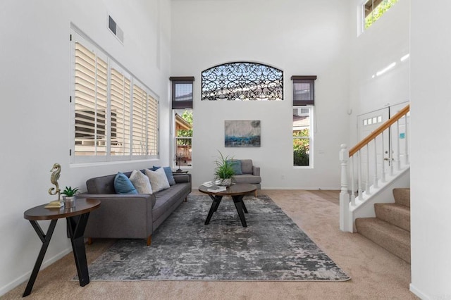 13756 Fontanelle Pl, San Diego, CA 92128 - carpeted living room featuring a high ceiling and stairs