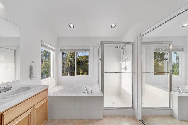 13756 Fontanelle Pl, San Diego, CA 92128 - full bathroom with healthy amount of natural light, vanity, a bath, a shower stall, and recessed lighting