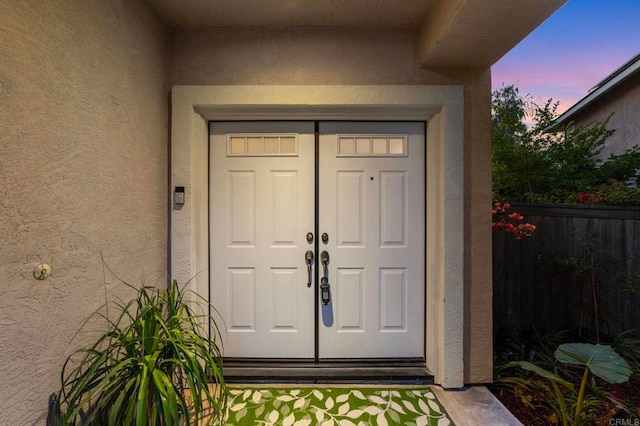 13756 Fontanelle Pl, San Diego, CA 92128 - exterior entry at dusk with stucco siding